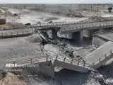 ویدیو  -  آسفالت مسیر جایگزین کنار گذر پل هدف قرار داده شده آمریکا در استان هرمزگان